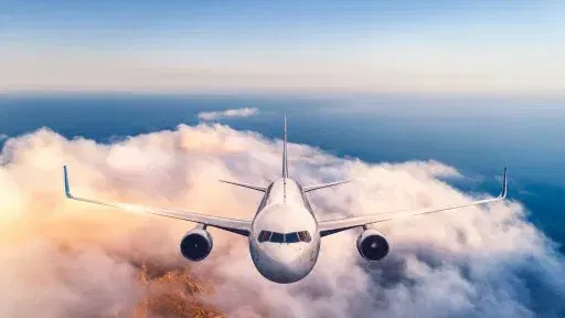 airplane-clouds-at-sunset-comp.webp