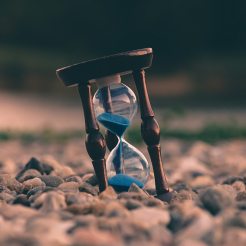 An hourglass depicting time running out for Drupal 9 launch