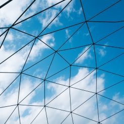 Glass roof and blue sky beyond