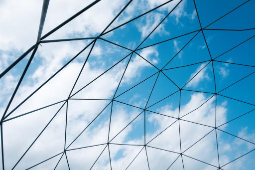 Glass roof and blue sky beyond