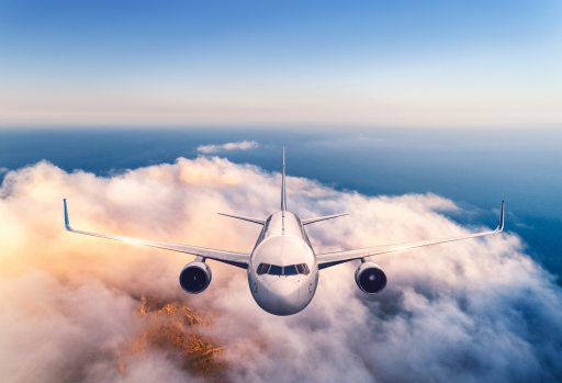 Aeroplane flying above clouds