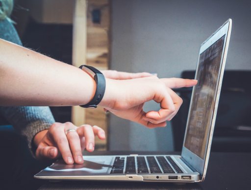 Two people discussing web application development